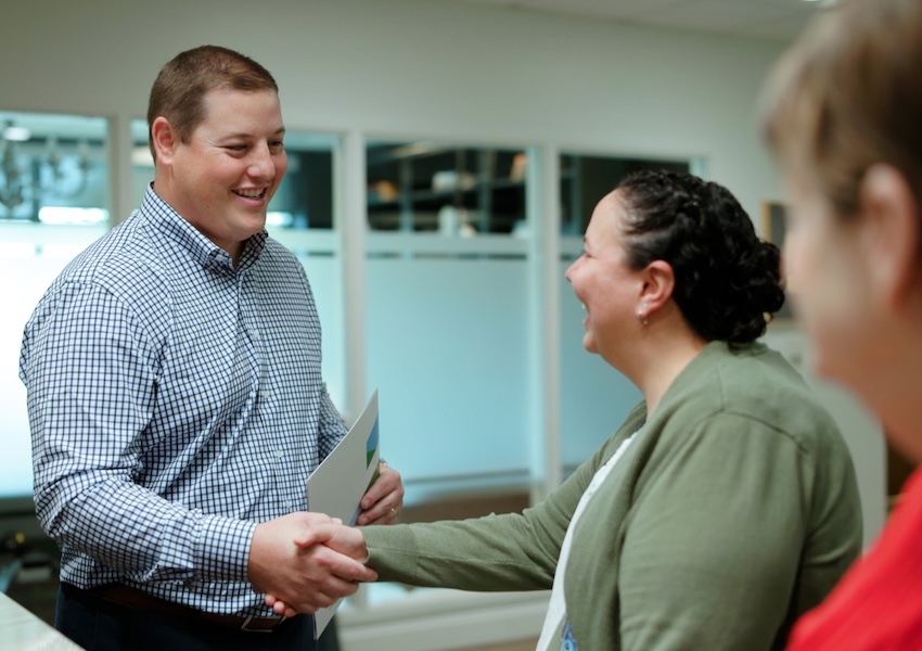Brian Rosso shaking hands with a client